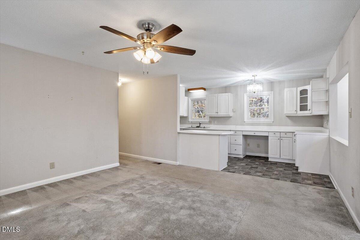 11907 North Roxboro Street Rougemont, NC 27572 - Photo 11 of 37 a view of kitchen with windows and ceiling fan