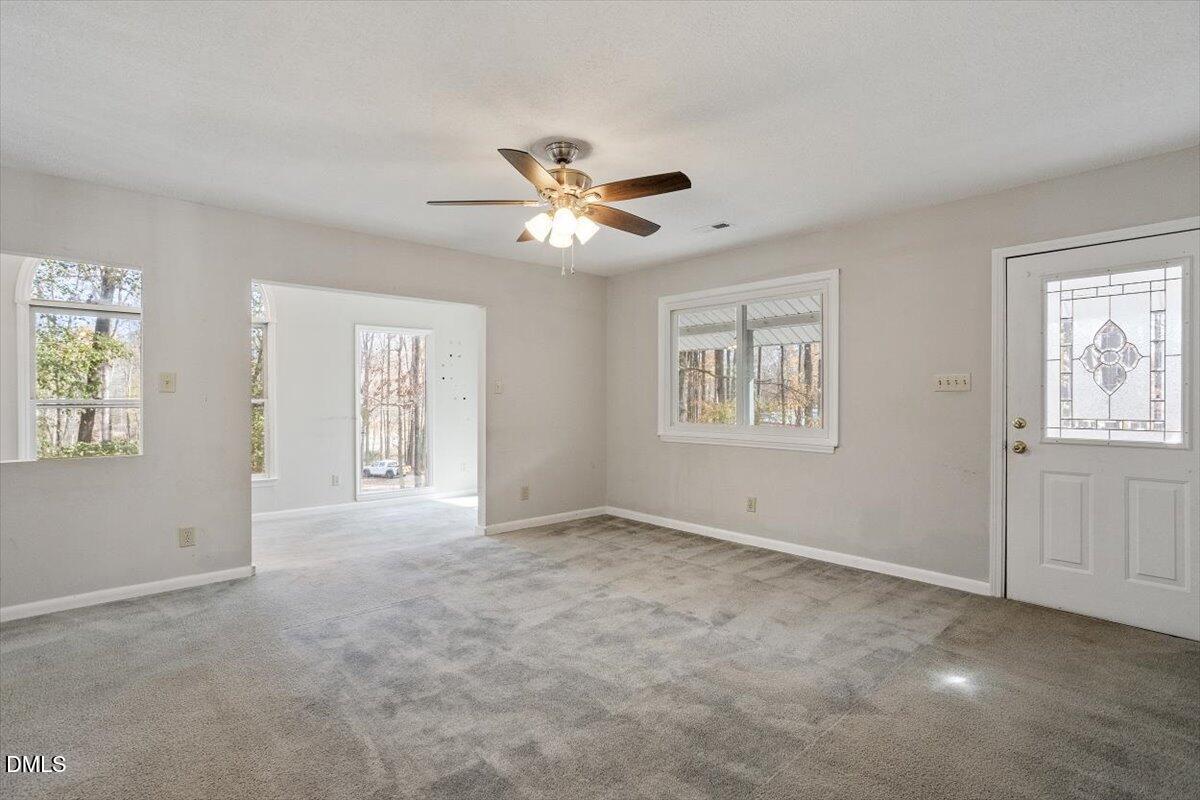 11907 North Roxboro Street Rougemont, NC 27572 - Photo 13 of 37 a view of an empty room with a window