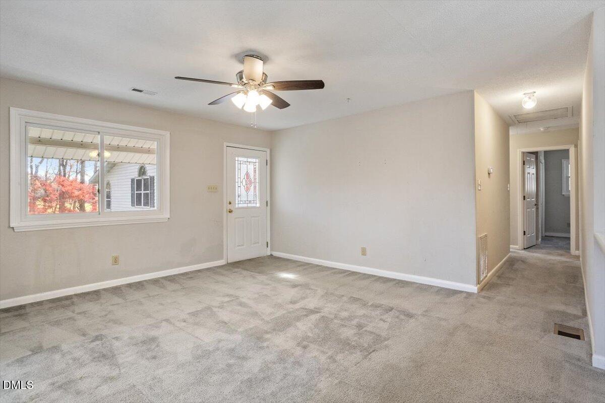 11907 North Roxboro Street Rougemont, NC 27572 - Photo 15 of 37 a view of an empty room with a window