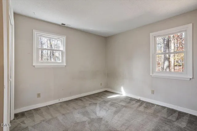 a view of empty room with windows
