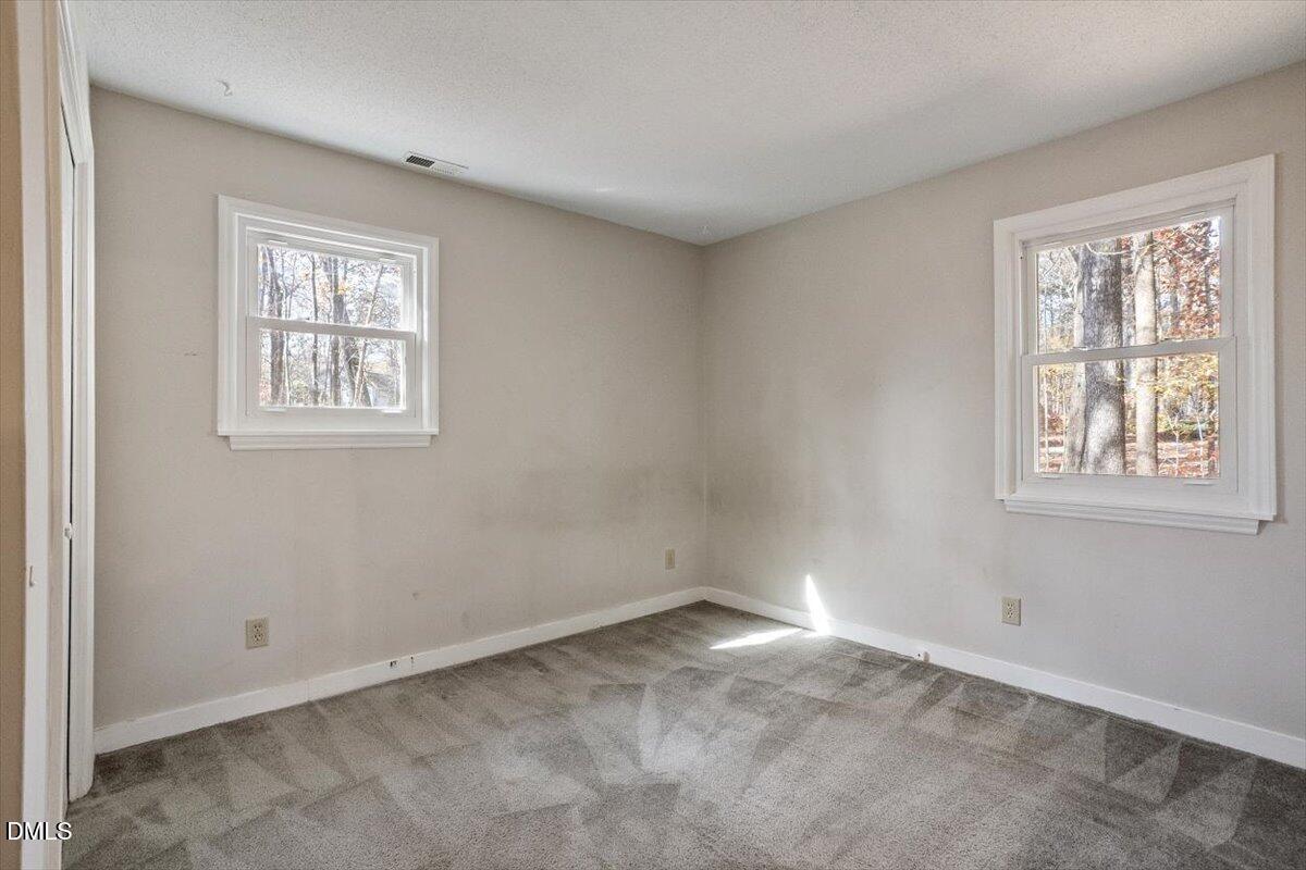 11907 North Roxboro Street Rougemont, NC 27572 - Photo 17 of 37 a view of an empty room with a window
