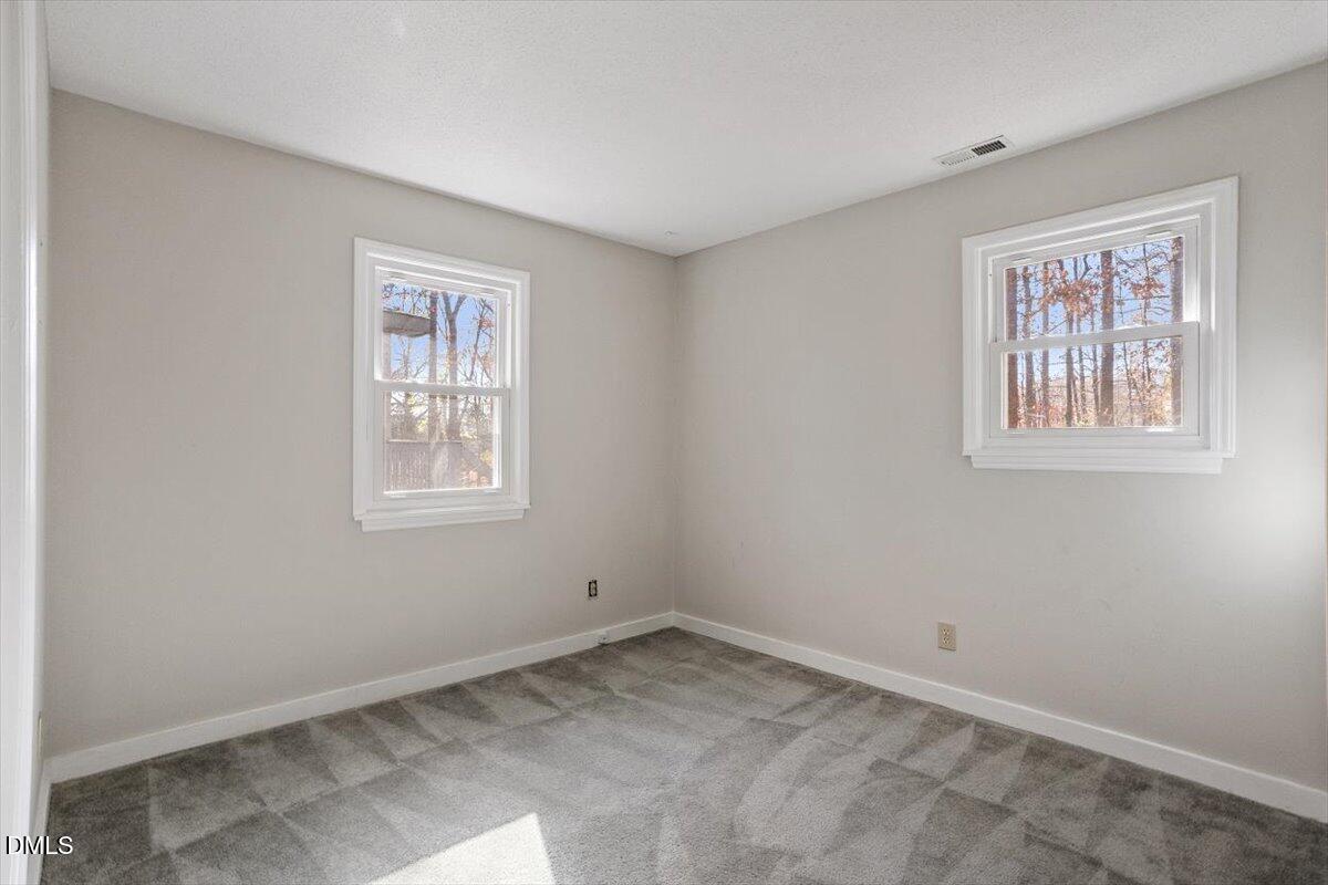 11907 North Roxboro Street Rougemont, NC 27572 - Photo 18 of 37 a view of empty room with windows