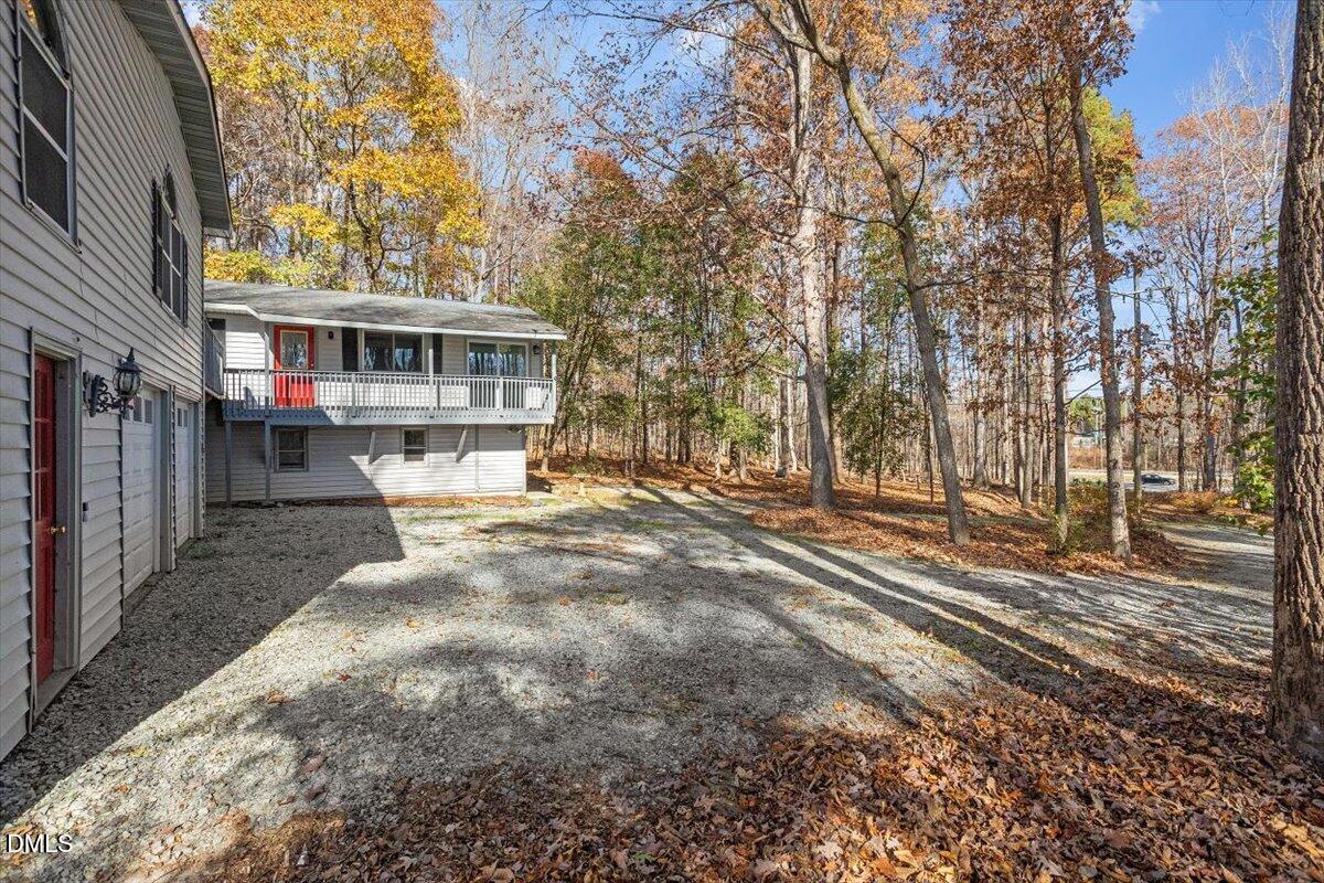 11907 North Roxboro Street Rougemont, NC 27572 - Photo 24 of 37 a view of a house with a yard