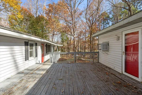 a view of backyard with a deck