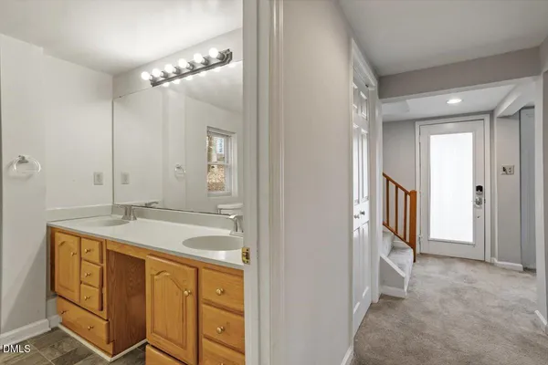 a bathroom with a sink a vanity and a mirror