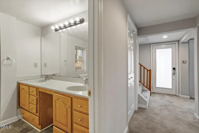 a bathroom with a sink a vanity and a mirror