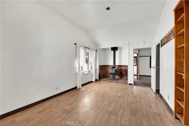 a view of a livingroom with furniture and an empty room