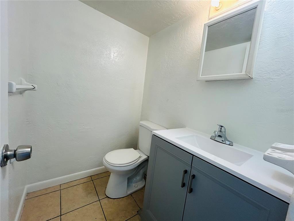 2777 L B McLeod Road, Unit D Orlando, FL 32805 - Photo 6 of 10 a bathroom with a sink and a toilet