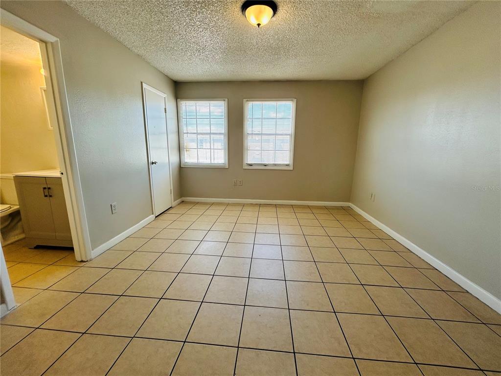 2777 L B McLeod Road, Unit D Orlando, FL 32805 - Photo 7 of 10 a view of an empty room and window