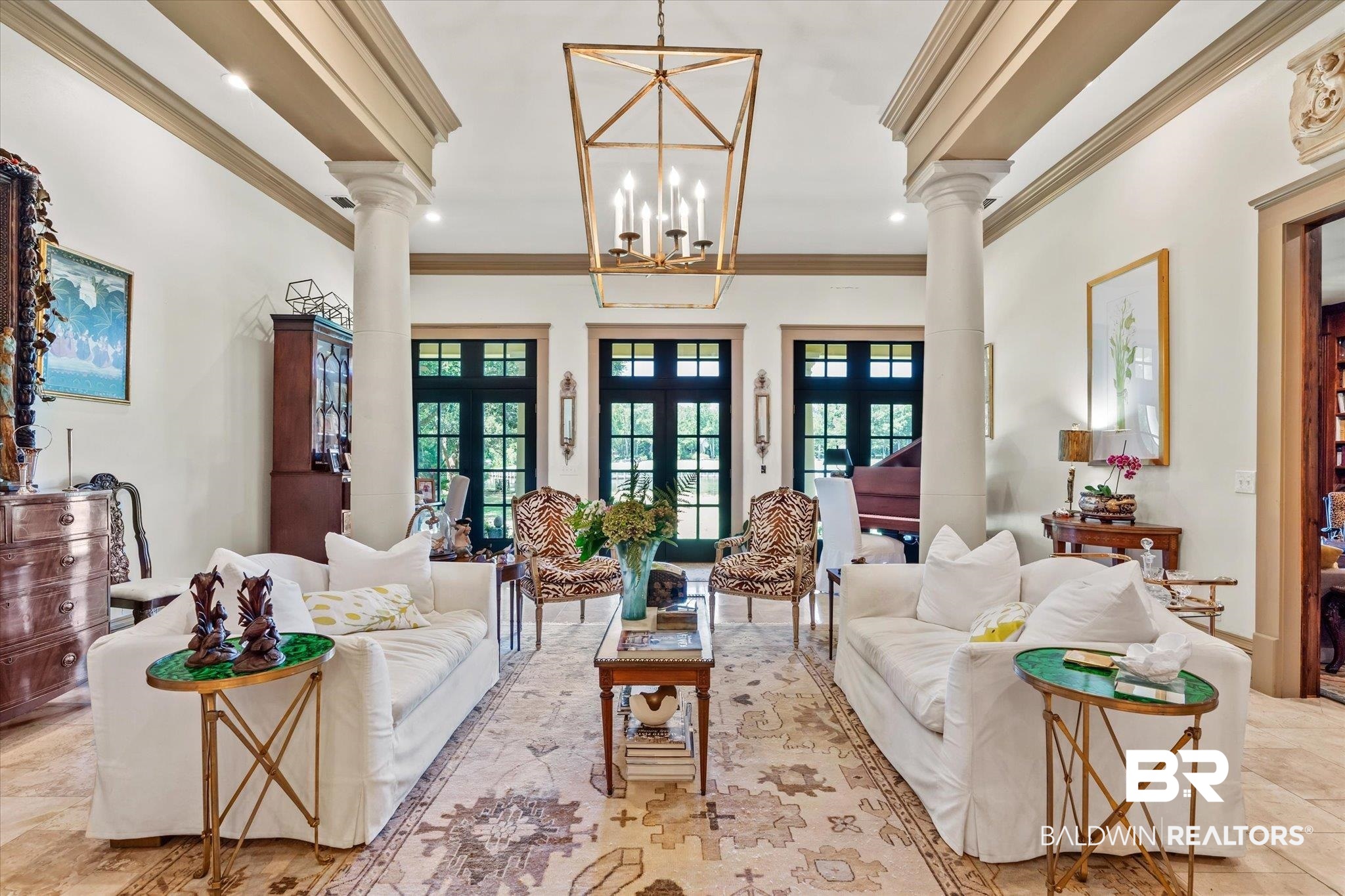 6341 Raintree Road Fairhope, AL 36532 - Photo 6 of 40 Tiled living room featuring a wealth of natural light, crown molding, ornate columns, and french doors