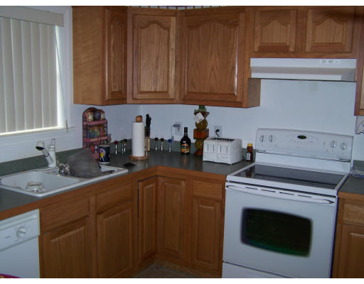 56 Shea Road West Brookfield, MA 01585 - Photo 5 of 6 a kitchen with a sink stove and cabinets