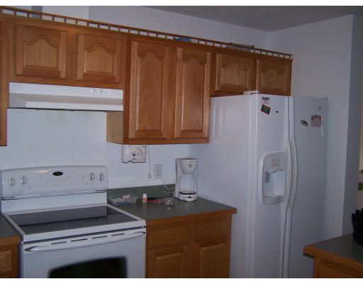 56 Shea Road West Brookfield, MA 01585 - Photo 6 of 6 a kitchen with a refrigerator and cabinets