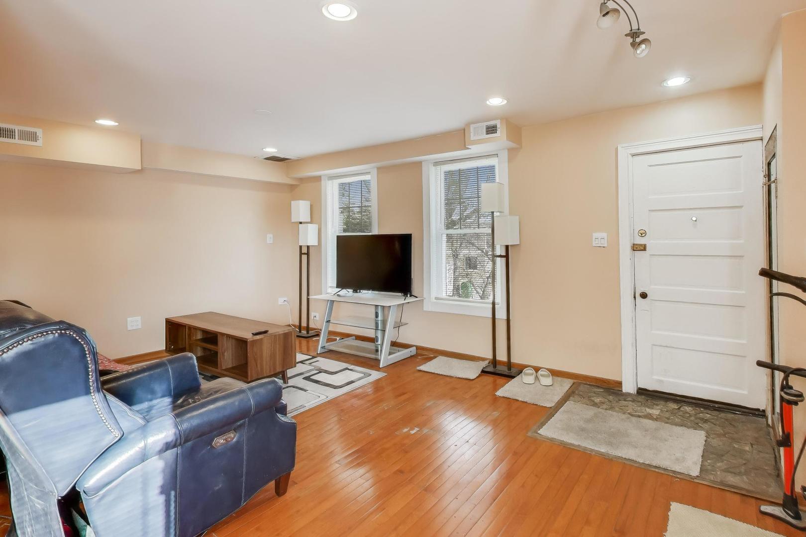3248 South Paulina Street Chicago, IL 60608 - Photo 15 of 43 a living room with furniture and a flat screen tv