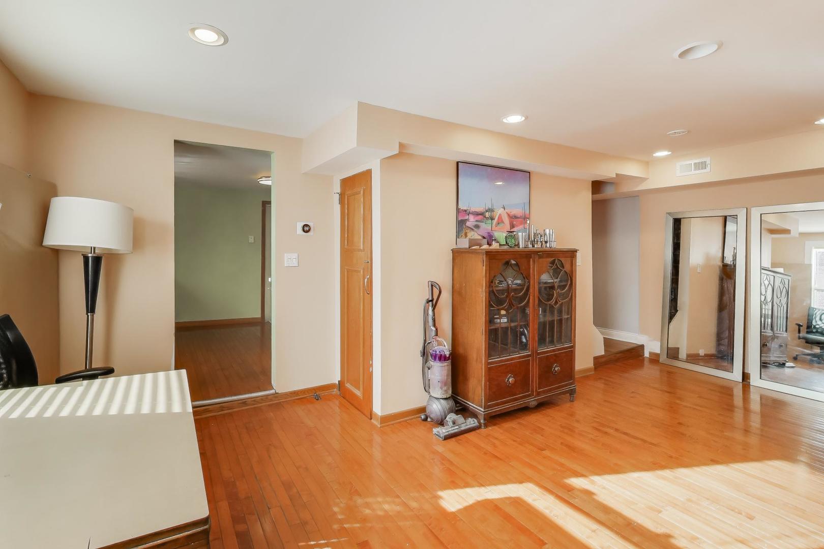 3248 South Paulina Street Chicago, IL 60608 - Photo 17 of 43 a view of a livingroom with furniture and an empty room