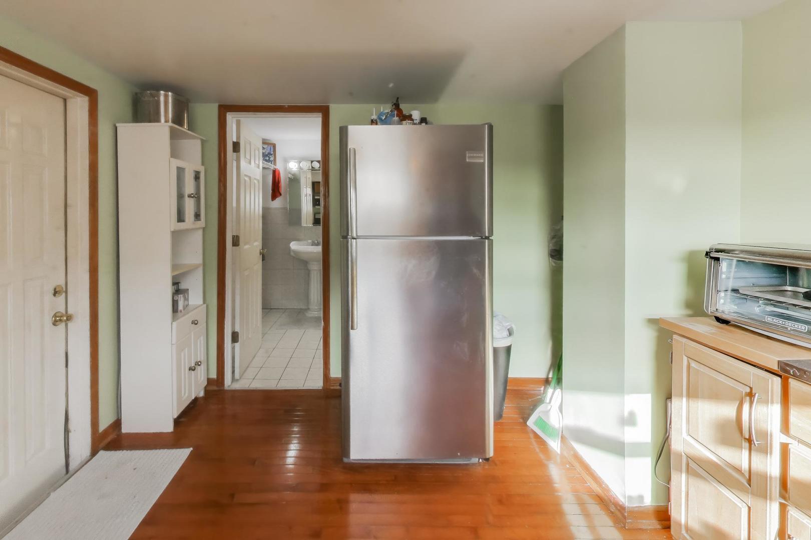 3248 South Paulina Street Chicago, IL 60608 - Photo 21 of 43 a view of kitchen with stainless steel appliances granite countertop cabinets and a refrigerator