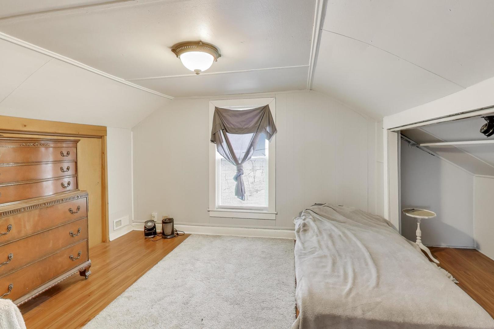 3248 South Paulina Street Chicago, IL 60608 - Photo 28 of 43 a bed room with a bed and a window