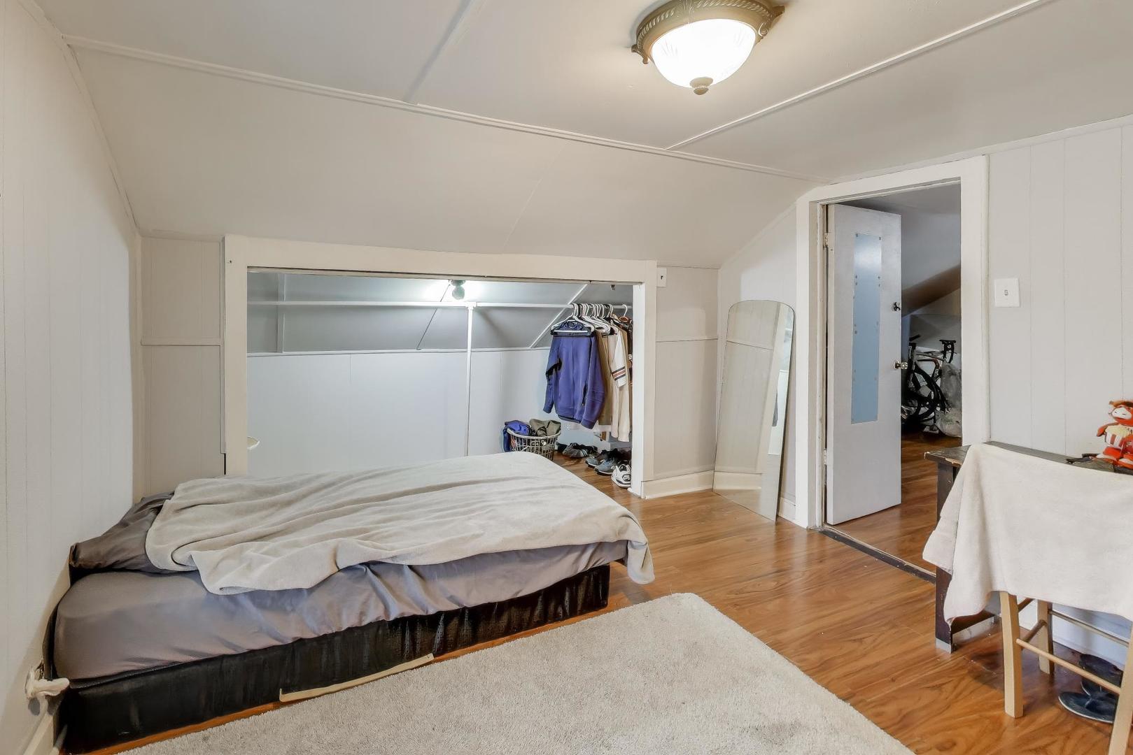 3248 South Paulina Street Chicago, IL 60608 - Photo 29 of 43 a bedroom with a bed and a desk