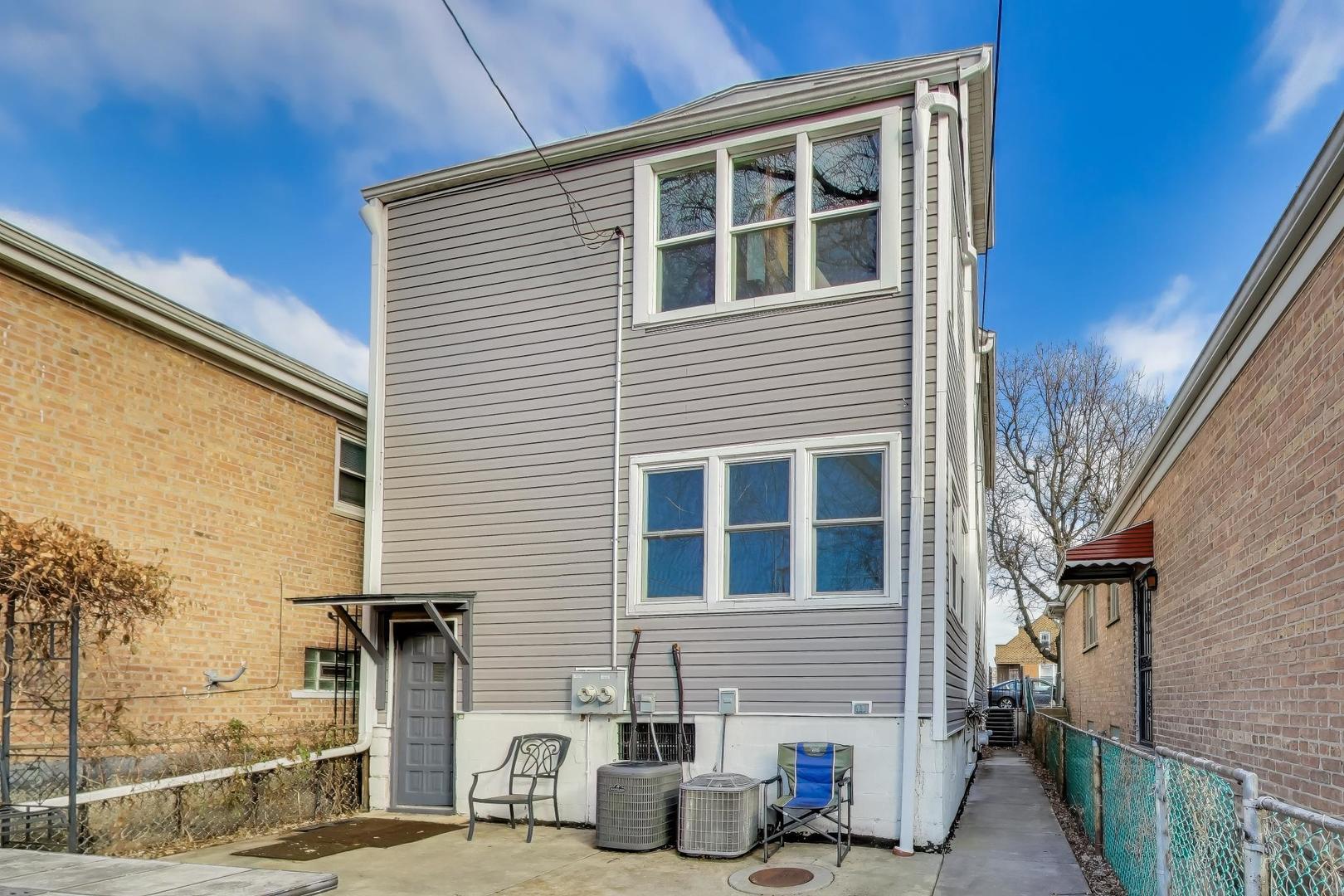 3248 South Paulina Street Chicago, IL 60608 - Photo 37 of 43 a front view of a house with windows