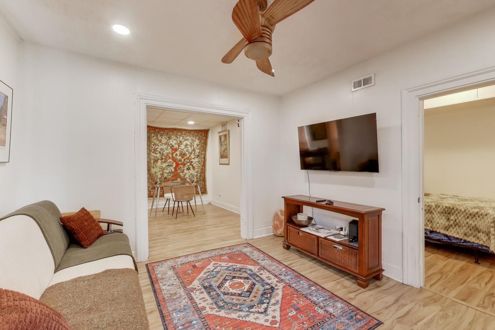 3248 South Paulina Street Chicago, IL 60608 - Photo 4 of 43 a living room with furniture and a flat screen tv