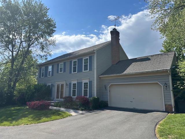 5423 Rilian Court Burke, VA 22015 - Photo 3 of 67 a front view of a house with garden