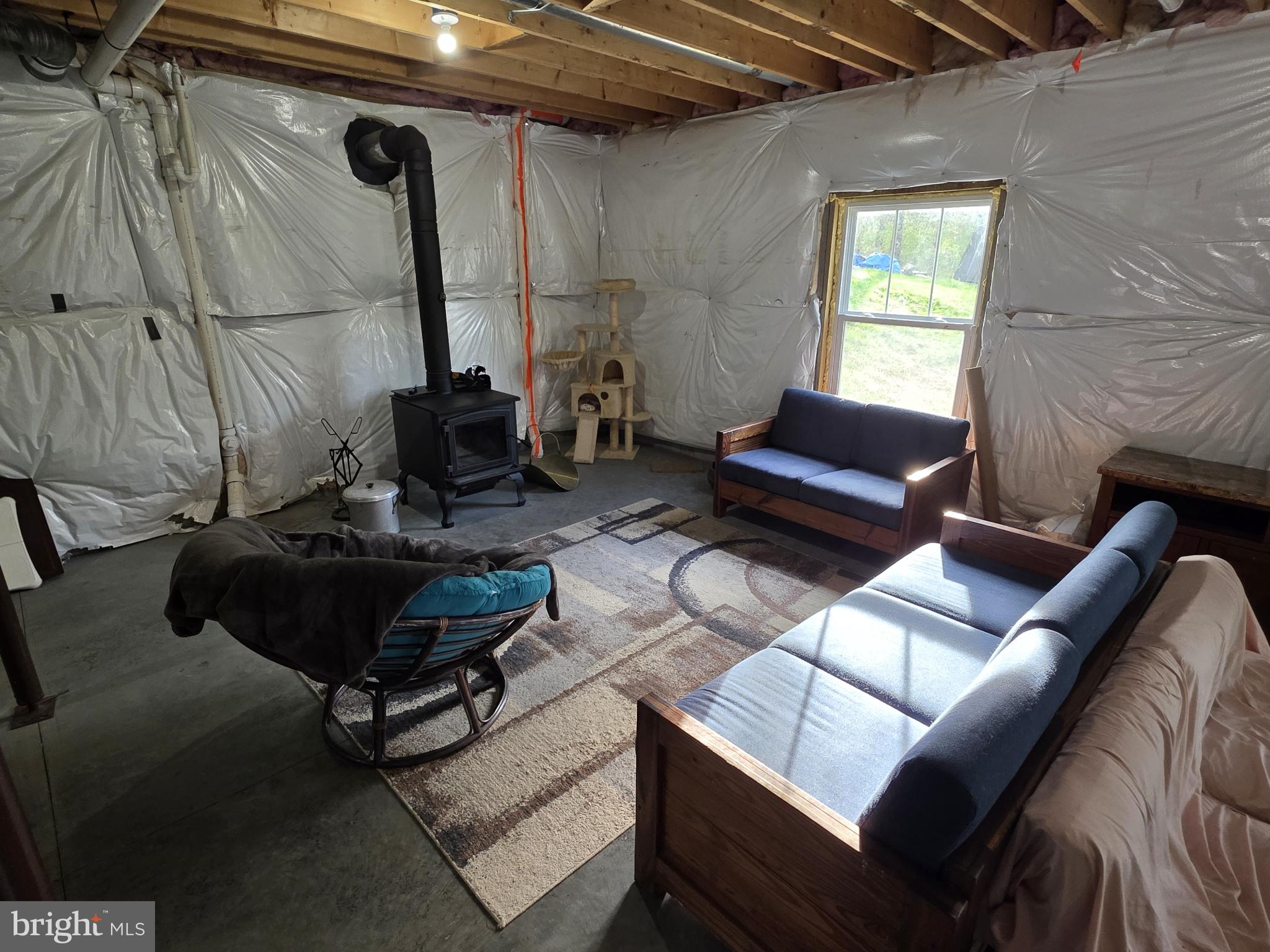 288 Cavern Road Hedgesville, WV 25427 - Photo 15 of 16 Unfinished basement with wood stove