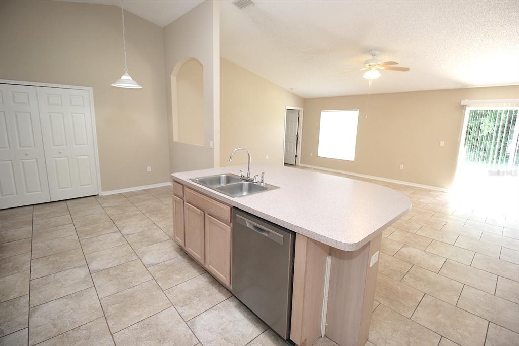 32 Ryding Lane Palm Coast, FL 32164 - Photo 14 of 38 a bathroom with a sink a vanity and a mirror