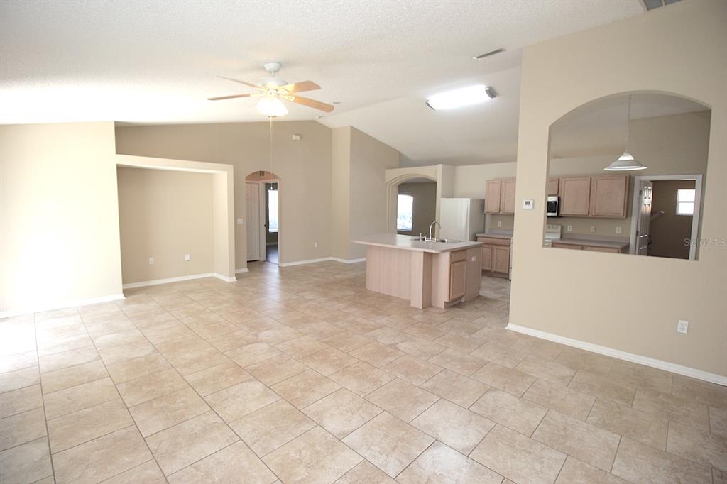 32 Ryding Lane Palm Coast, FL 32164 - Photo 20 of 38 a view of a kitchen with furniture and an open kitchen view