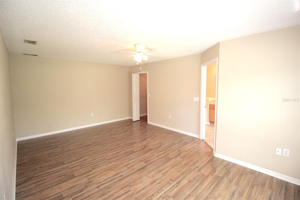 32 Ryding Lane Palm Coast, FL 32164 - Photo 22 of 38 a view of an empty room with wooden floor