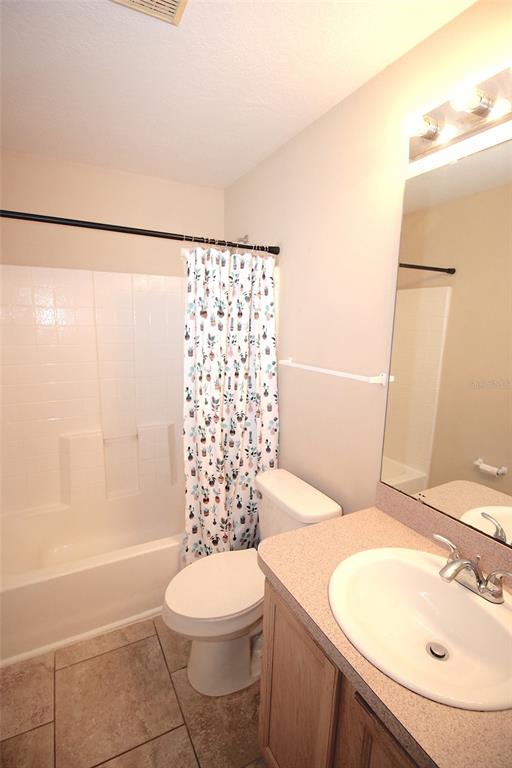 32 Ryding Lane Palm Coast, FL 32164 - Photo 28 of 38 a bathroom with a sink a toilet and shower