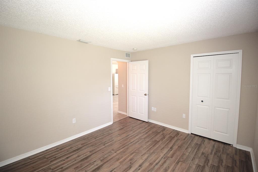 32 Ryding Lane Palm Coast, FL 32164 - Photo 30 of 38 a view of an empty room with wooden floor