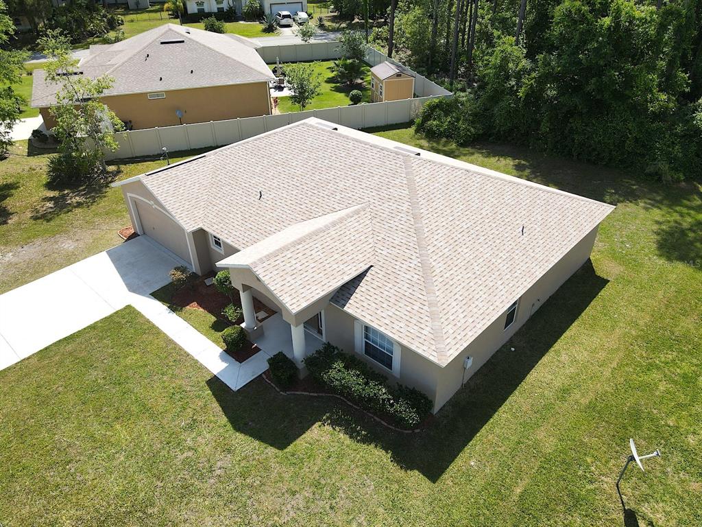 32 Ryding Lane Palm Coast, FL 32164 - Photo 7 of 38 an aerial view of a house having yard