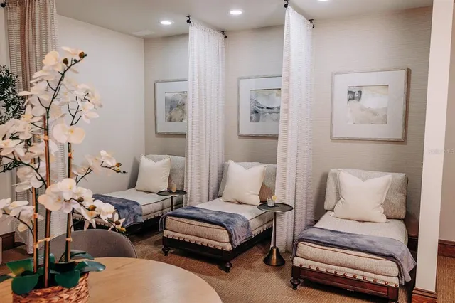 a view of a house with swimming pool and porch with furniture