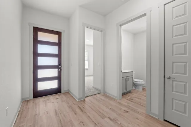 a view of a room with wooden floor and closet