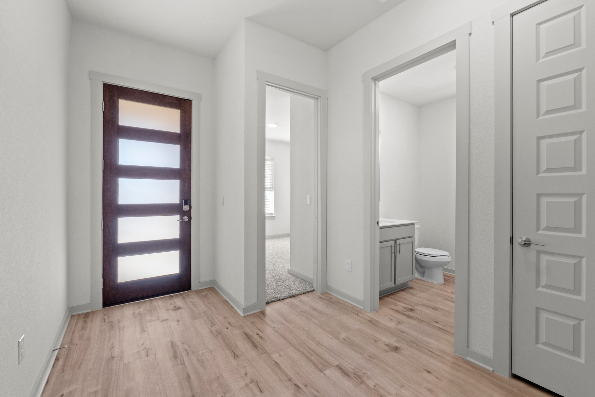 2201 Bobtail Pass Leander, TX 78641 - Photo 16 of 34 a view of a room with wooden floor and closet