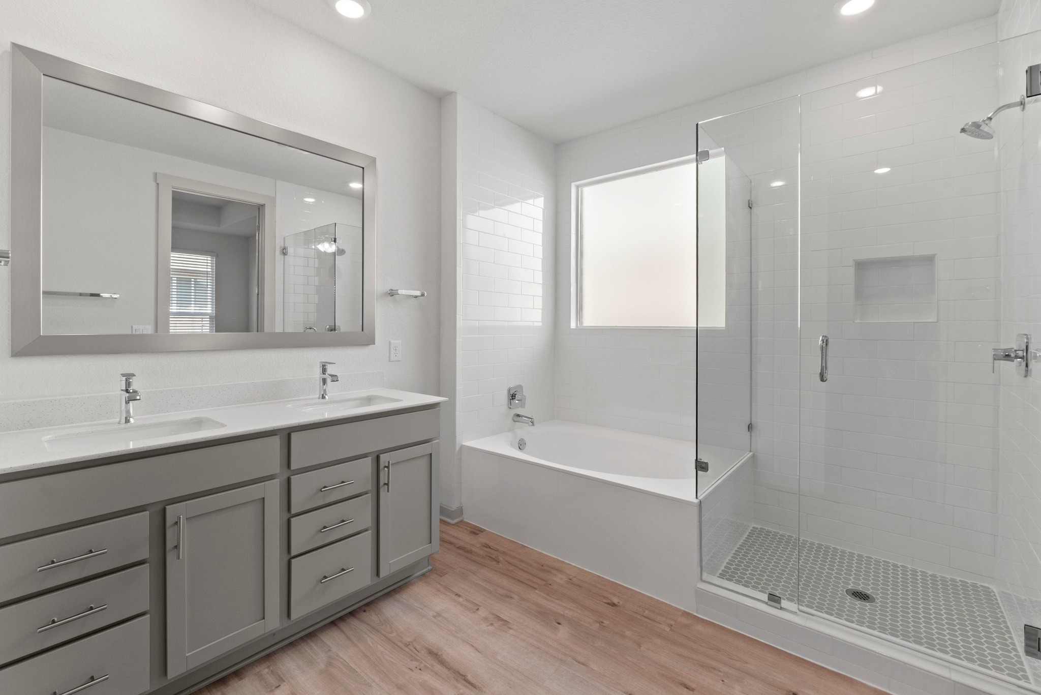 2201 Bobtail Pass Leander, TX 78641 - Photo 21 of 34 a bathroom with a double vanity sink and a mirror