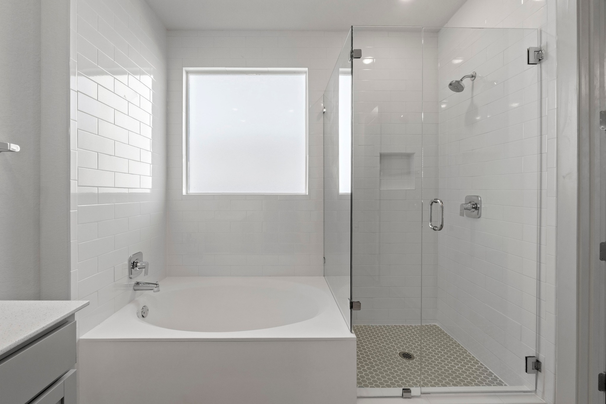 2201 Bobtail Pass Leander, TX 78641 - Photo 22 of 34 a white bath tub sitting next to a shower