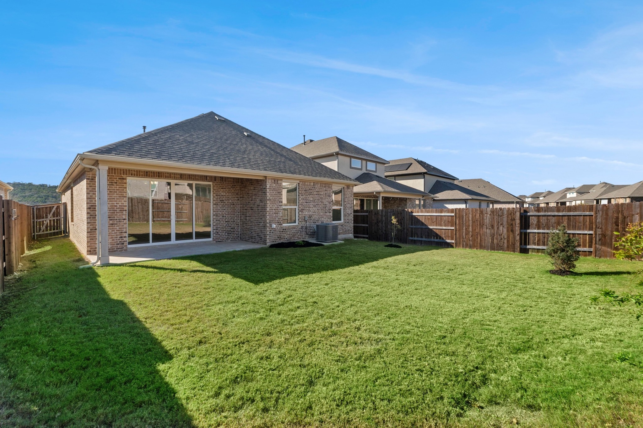 2201 Bobtail Pass Leander, TX 78641 - Photo 32 of 34 a front view of a house with garden