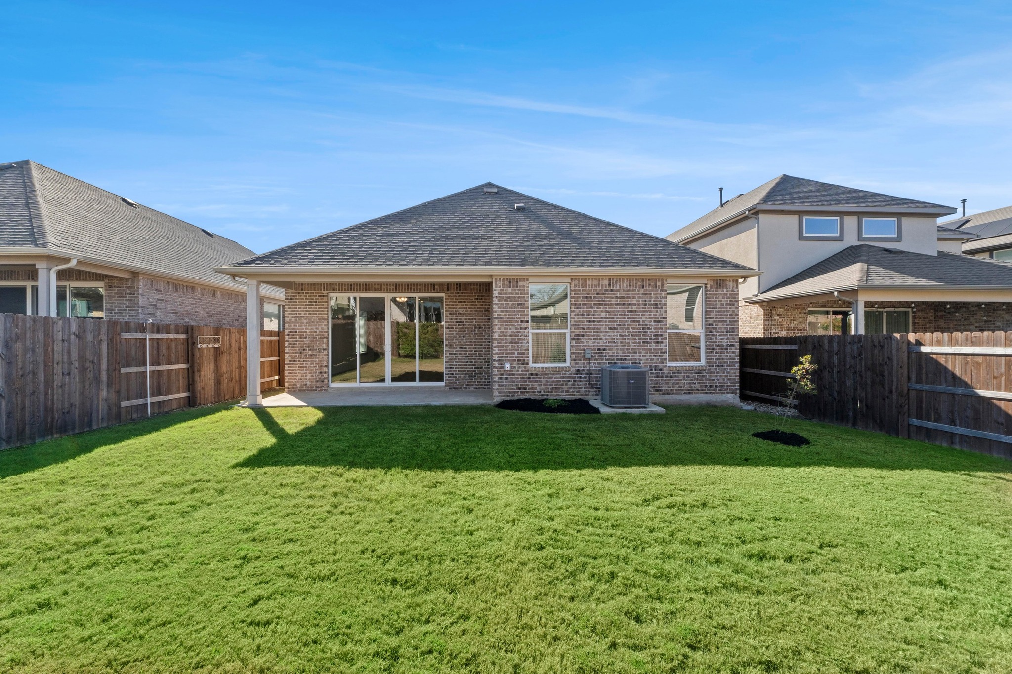 2201 Bobtail Pass Leander, TX 78641 - Photo 33 of 34 a front view of a house with a yard and garage