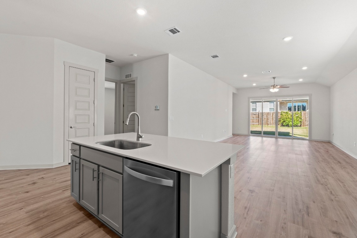 2201 Bobtail Pass Leander, TX 78641 - Photo 10 of 30 a kitchen with a sink and cabinets