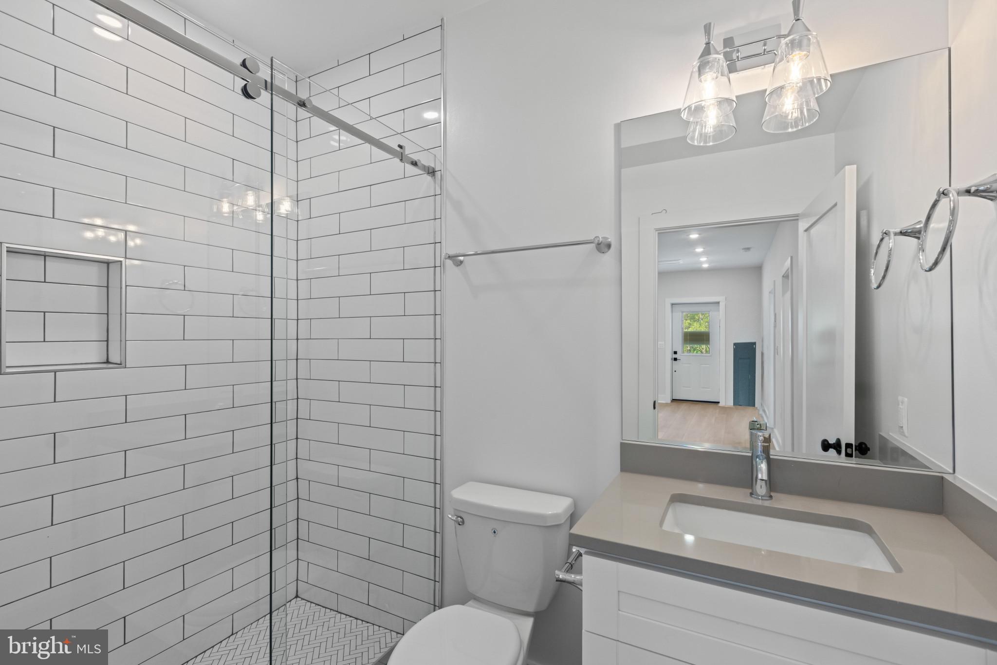 2236 40th Street Northwest, Unit FIVE Washington, DC 20007 - Photo 17 of 37 a bathroom with a sink a toilet and shower