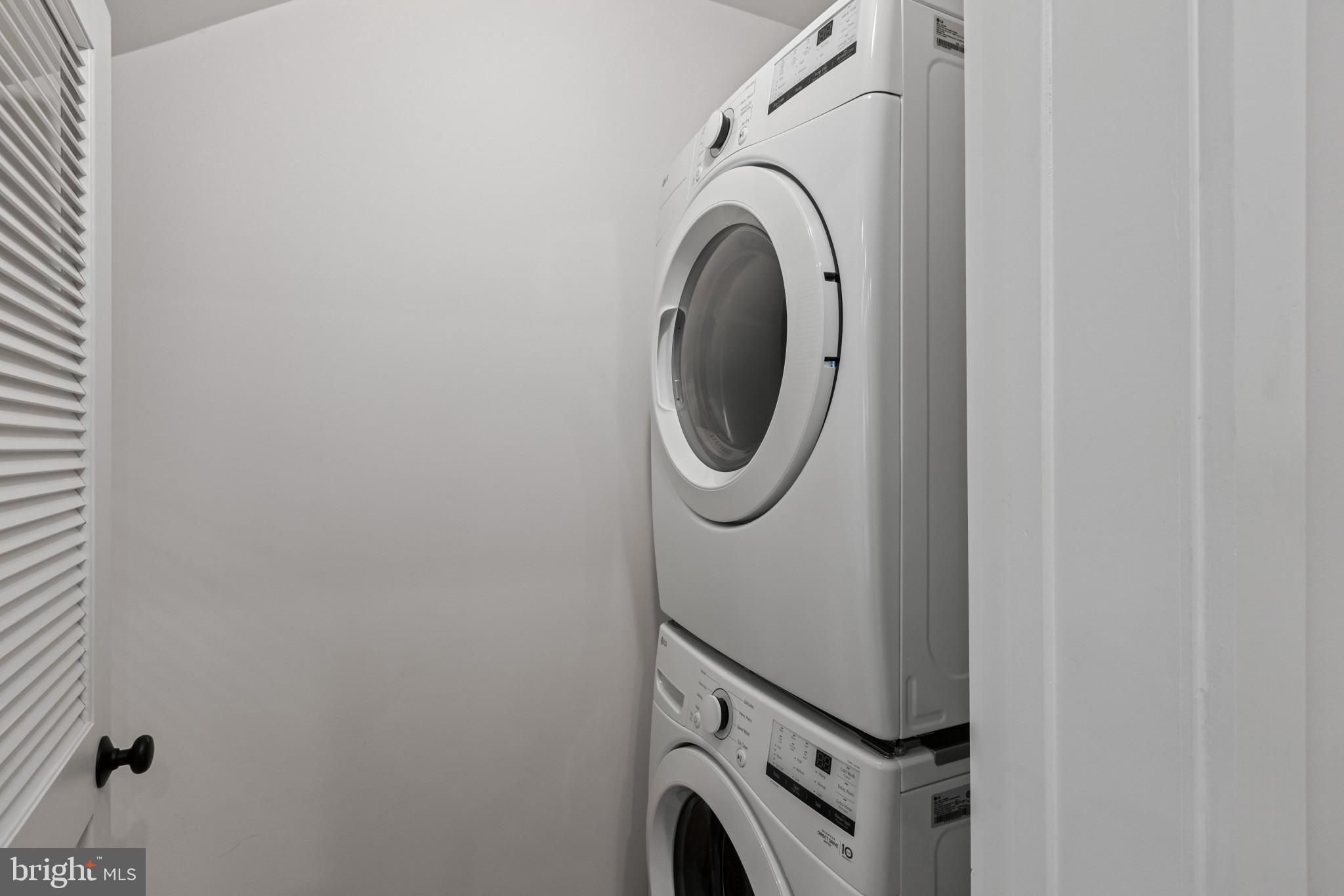 2236 40th Street Northwest, Unit FIVE Washington, DC 20007 - Photo 18 of 37 a utility room with dryer and washer