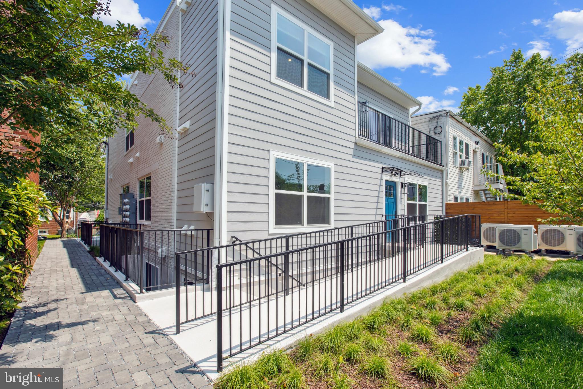 2236 40th Street Northwest, Unit FIVE Washington, DC 20007 - Photo 21 of 37 a view of a house with a small yard and wooden fence