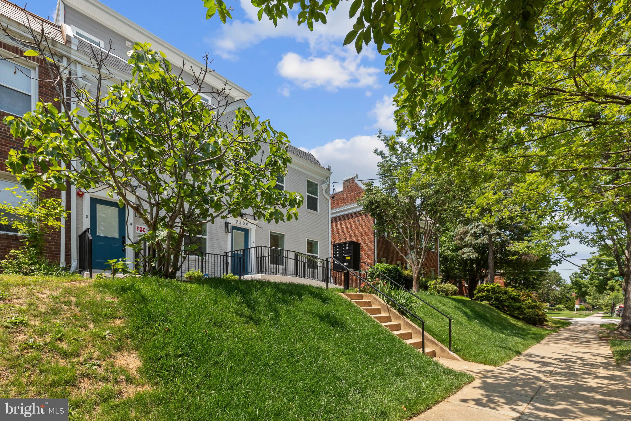 2236 40th Street Northwest, Unit FIVE Washington, DC 20007 - Photo 24 of 37 a view of house with a yard