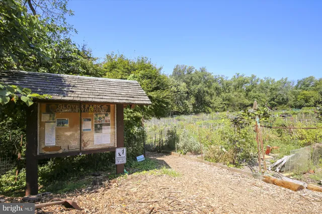 a view of a wooden house with a yard
