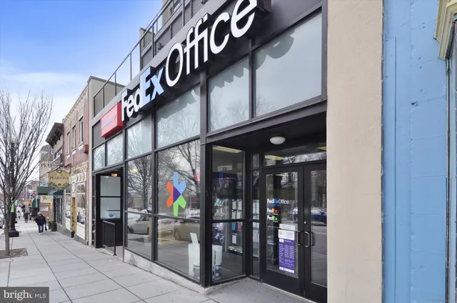 a view of shops on a street