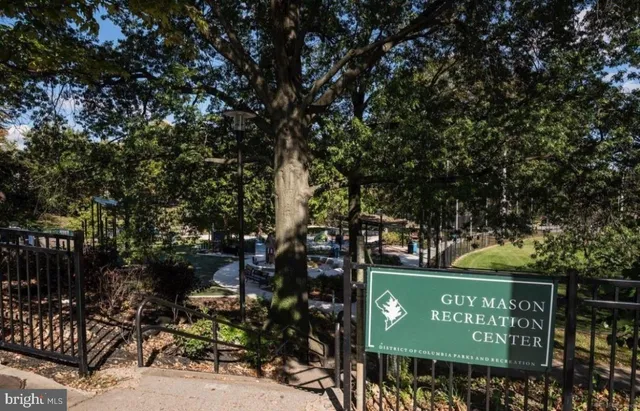 a view of outdoor space with signage and flags