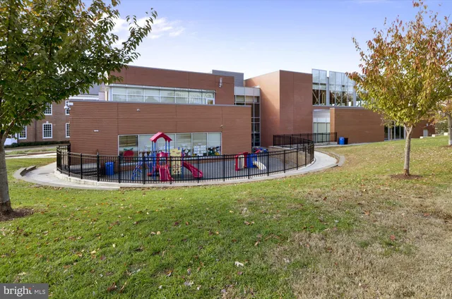 a view of a house with pool and a yard