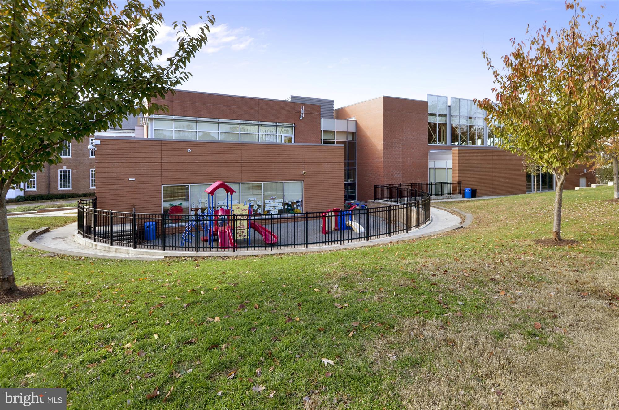 2236 40th Street Northwest, Unit FIVE Washington, DC 20007 - Photo 36 of 37 a view of a house with pool and a yard