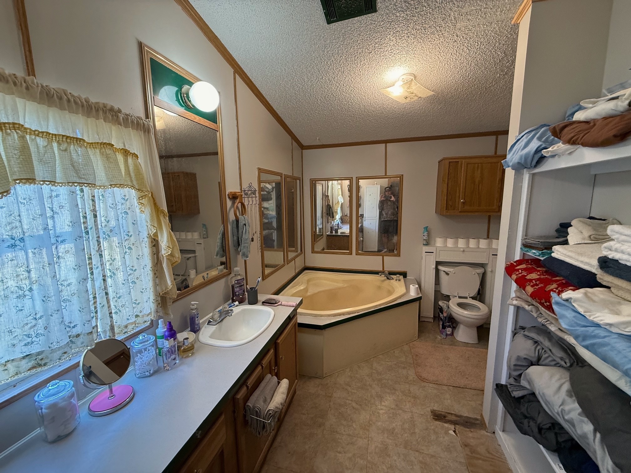 20197 Interstate 45 Buffalo, TX 75831 - Photo 11 of 30 a bedroom with a bed and a dresser