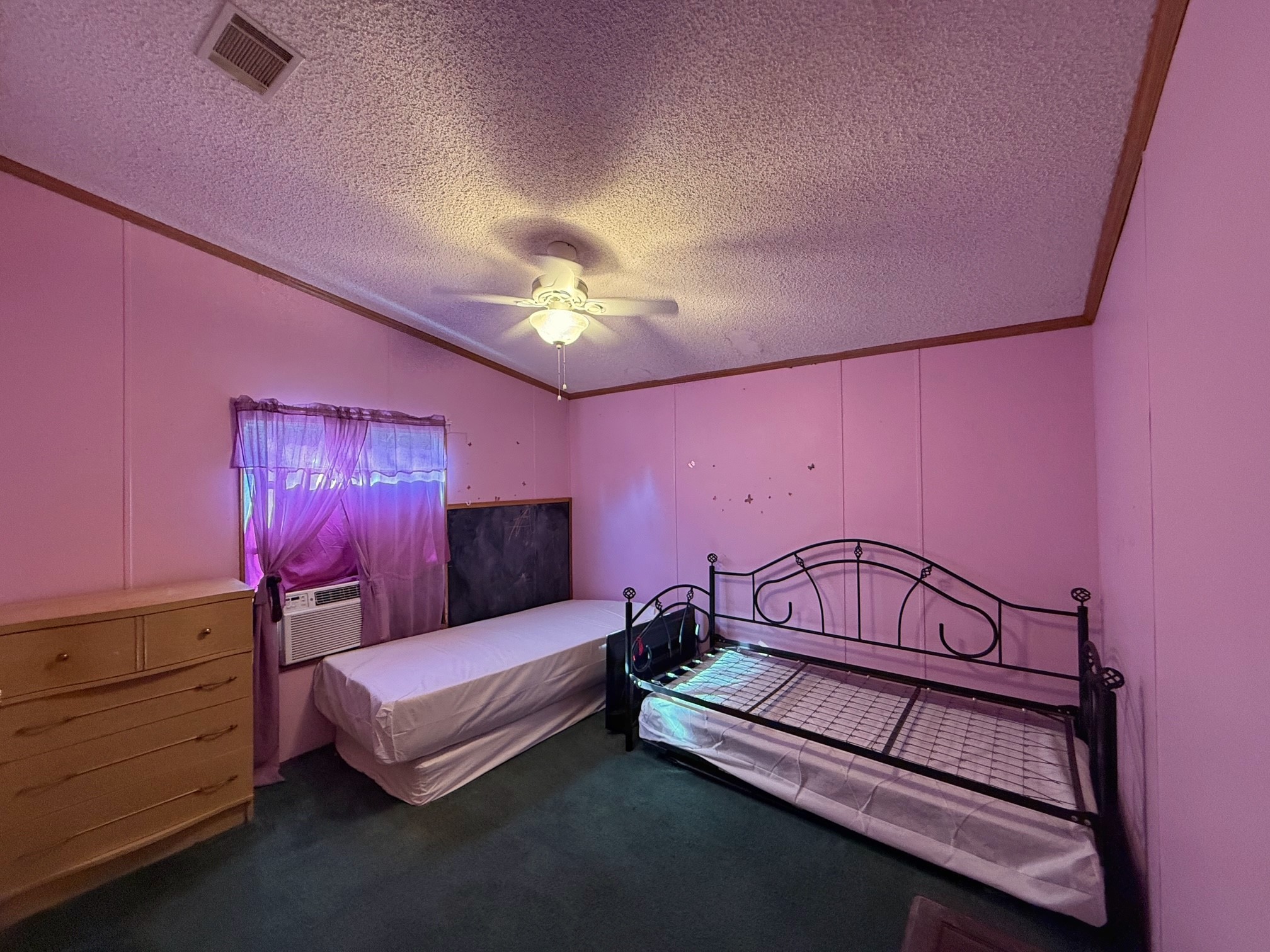 20197 Interstate 45 Buffalo, TX 75831 - Photo 13 of 30 a bedroom with furniture and a chandelier